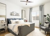 Thumbnail 8 of 30 - a bedroom with a large bed and a large window