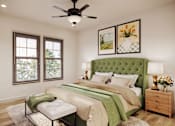 Thumbnail 2 of 16 - A bedroom with a green headboard and a white bed.