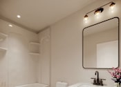 Thumbnail 5 of 16 - A white bathroom with a wooden floor and a white toilet.