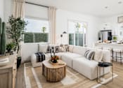Thumbnail 9 of 20 - A modern living room with a white sofa, wooden coffee table, and a large window.