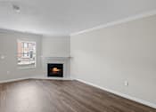 Thumbnail 51 of 54 - A room with a fireplace and a window.