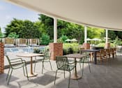 Thumbnail 32 of 37 - A patio with a table and chairs is shown.