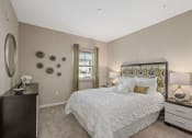 Thumbnail 7 of 23 - a bedroom with a large bed and a window