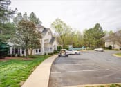 Thumbnail 2 of 29 - a suburban street with cars parked in front of houses