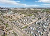 Thumbnail 22 of 40 - A suburban neighborhood with houses and a road.
