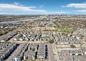 Thumbnail 23 of 40 - A bird's eye view of a residential area with multiple houses and buildings.