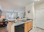 Thumbnail 12 of 37 - A kitchen with a star decoration on the wall.