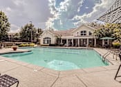 Thumbnail 29 of 37 - A large swimming pool in front of a house.