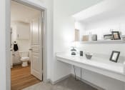 Thumbnail 24 of 41 - a bathroom with a mirror and a door to the toilet