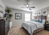Thumbnail 15 of 62 - the master bedroom in a new home with a bed and a ceiling fan