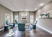 Thumbnail 24 of 62 - the living room of a home with chairs and a table