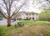 Thumbnail 14 of 29 - a house with a picnic table in front of it