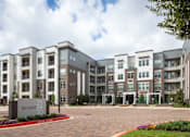 Thumbnail 6 of 43 - parking lot entrance to out facility