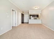 Thumbnail 4 of 37 - the living room and kitchen in a 555 waverly unit