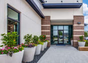 Thumbnail 39 of 41 - large potted plants in front of the leasing office