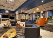 Thumbnail 15 of 17 - a lobby of a hotel with couches and chairs