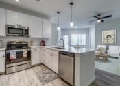 Thumbnail 25 of 65 - the preserve at ballantyne commons apartment kitchen and living room