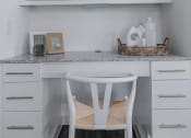 Thumbnail 30 of 43 - a small white desk with a white chair in a white kitchen