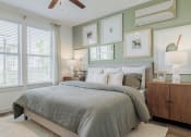 Thumbnail 27 of 43 - a bedroom with a bed and a ceiling fan