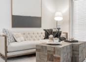 Thumbnail 3 of 35 - a living room with a couch and a coffee table