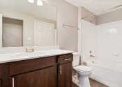 Thumbnail 7 of 37 - a bathroom with a sink toilet and bathtub