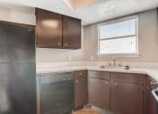 Thumbnail 16 of 36 - a kitchen with a dishwasher sink and refrigerator