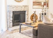 Thumbnail 1 of 34 - a living room with a fireplace and a mirror above it