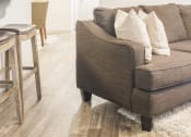 Thumbnail 2 of 34 - a living room with a couch and a table