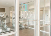 Thumbnail 26 of 34 - a gym with a sign in the window that reads 300 hickory fitness center