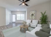 Thumbnail 28 of 65 - an open living room with white furniture and a ceiling fan