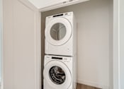 Thumbnail 15 of 22 - a washer and dryer in a laundry room