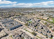 Thumbnail 32 of 40 - A bird's eye view of a residential area with houses and cars.