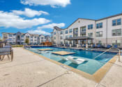 Thumbnail 23 of 37 - our apartments have a resort style pool with seating and tables