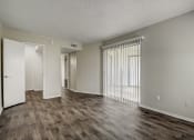 Thumbnail 10 of 36 - an empty living room with a hardwood floor