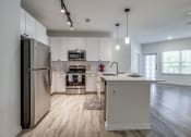 Thumbnail 22 of 65 - the preserve at ballantyne commons apartment kitchen with stainless steel appliances