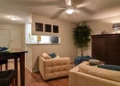 Thumbnail 6 of 8 - a living room with a couch and a table
