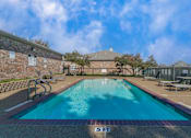 Thumbnail 17 of 22 - A large outdoor swimming pool with the letters "SFT" on the bottom.