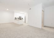 Thumbnail 5 of 41 - an empty living room and kitchen with white walls and flooring