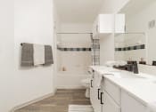 Thumbnail 10 of 26 - a small bathroom with a shower and a sink and a toilet