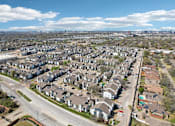 Thumbnail 37 of 40 - A suburban neighborhood with houses and a road.