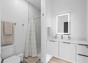 Thumbnail 32 of 35 - A white bathroom with a towel hanging on the wall.