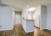 Thumbnail 17 of 29 - a renovated kitchen with white appliances and hard wood flooring