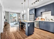 Thumbnail 10 of 33 - Navy blue kitchen style with stainless steel appliances