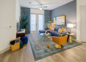 Thumbnail 3 of 36 - an open living room with blue walls and a ceiling fan