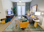 Thumbnail 2 of 36 - a living room with a couch and a tv