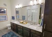 Thumbnail 12 of 36 - Bathroom with double vanities