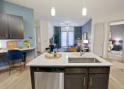 Thumbnail 6 of 36 - Open floor plan with kitchen island and dishwasher