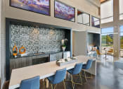 Thumbnail 24 of 36 - a dining room with a long table and chairs and a fireplace