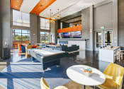 Thumbnail 23 of 36 - a clubhouse with tables and chairs and a pool table