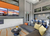 Thumbnail 19 of 36 - a rendering of a lobby with couches and a coffee table